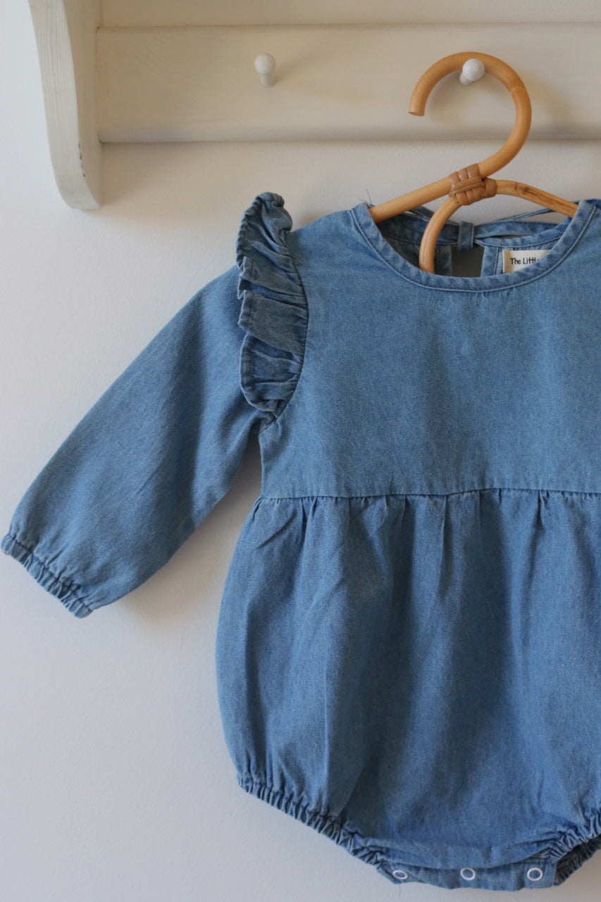BLUE CHAMBRAY RUFFLE ROMPER