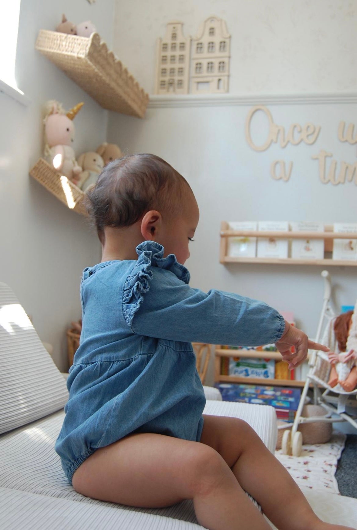 BLUE CHAMBRAY RUFFLE ROMPER