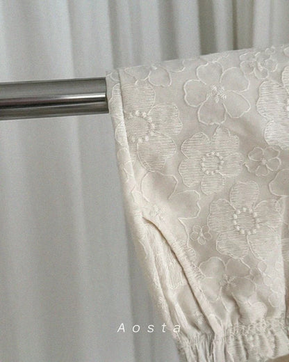 Girls Pants with floral lace detail and a metal rod, branded 'Aosta'.