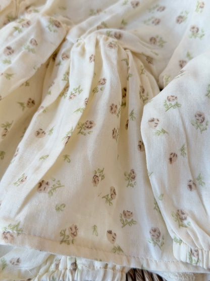 close up of a  cream floral print romper 