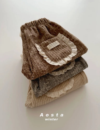 BROWN FLORAL CORDUROY TROUSERS WITH BRODERIE FRILL