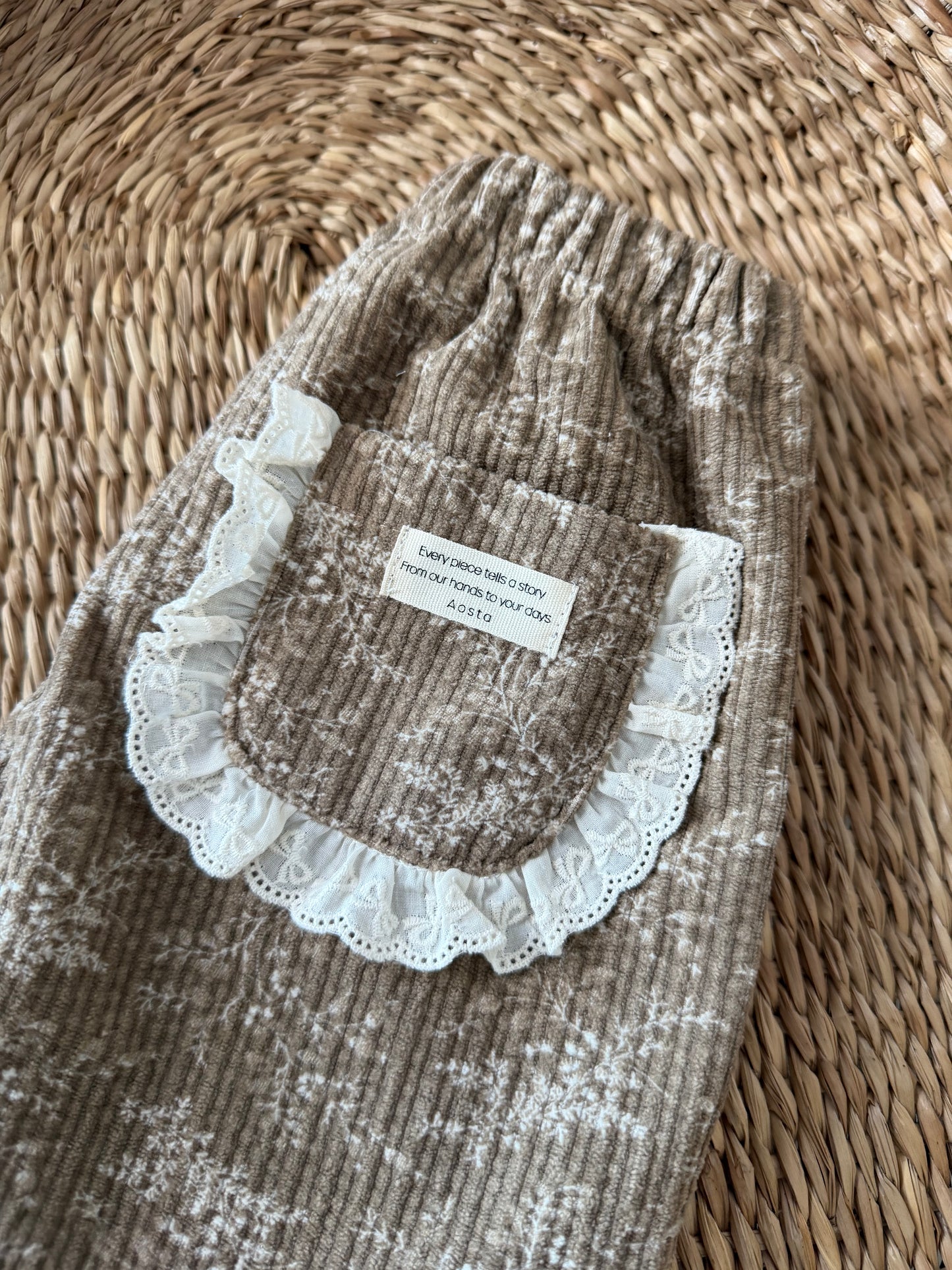 BROWN FLORAL CORDUROY TROUSERS WITH BRODERIE FRILL