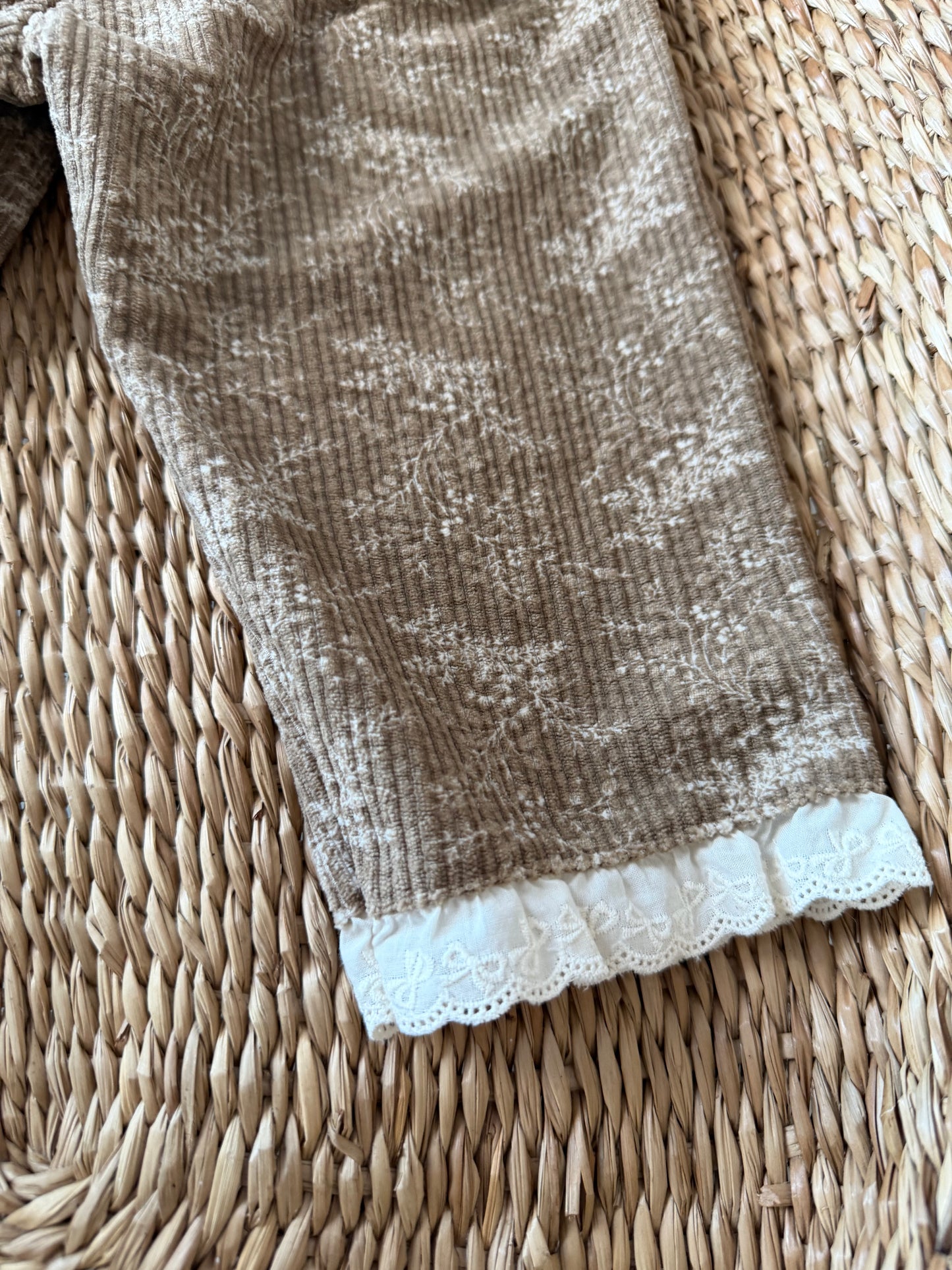 BROWN FLORAL CORDUROY TROUSERS WITH BRODERIE FRILL