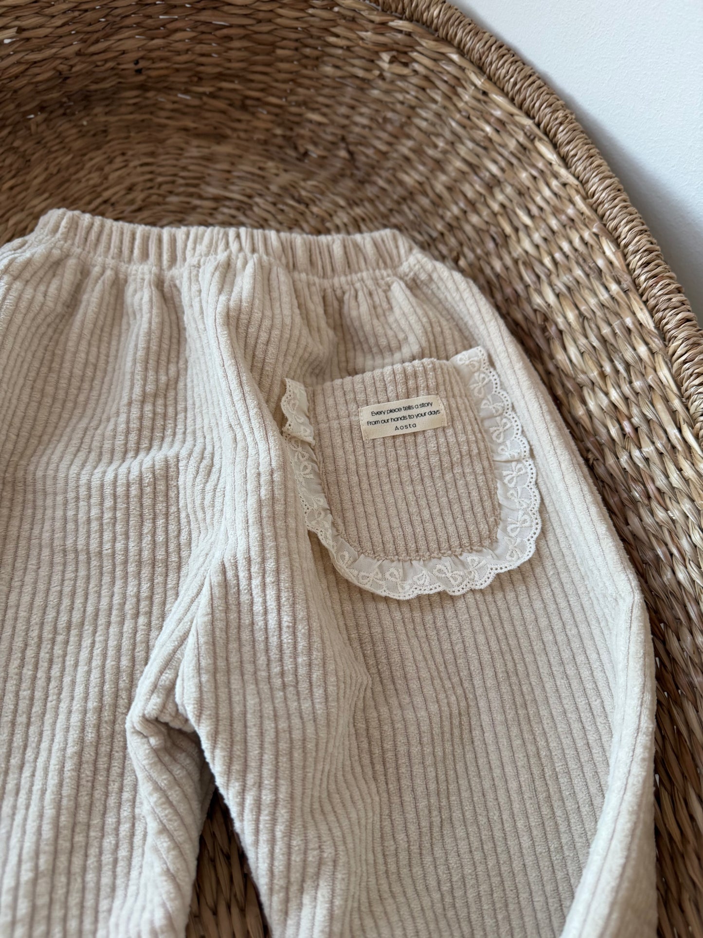 BEIGE CORDUROY TROUSERS WITH BRODERIE FRILL